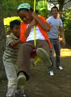 Kids playing on a Tree Swing